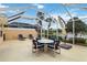 Screened lanai with seating area and view of the water at 6209 Erice St, Venice, FL 34293