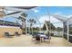 Screened lanai with seating area and view of the water at 6209 Erice St, Venice, FL 34293