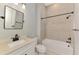 Modern bathroom featuring a white vanity with black hardware and a tiled shower-tub combination at 6267 Crested Eagle Ln, Nokomis, FL 34275