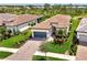 Beautiful home with a paver driveway, attached two car garage, and lush landscaping in a well-maintained neighborhood at 6267 Crested Eagle Ln, Nokomis, FL 34275