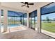 Covered lanai overlooking the swimming pool, lake, and backyard at 6267 Crested Eagle Ln, Nokomis, FL 34275