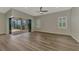 Open living space with sliding glass doors providing natural light and access to outdoor living areas at 6267 Crested Eagle Ln, Nokomis, FL 34275