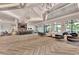 Spacious lounge area featuring comfortable seating, stylish decor, a bar, and access to the pool area at 6267 Crested Eagle Ln, Nokomis, FL 34275