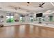 Bright studio space with hardwood floors, mirrors, and natural light, perfect for various activities at 6267 Crested Eagle Ln, Nokomis, FL 34275