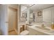 Bathroom featuring a shower with glass wall, classic sink, toilet, and mirrored medicine cabinet at 6267 Midnight Pass Rd # 306, Sarasota, FL 34242