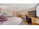 Spacious bedroom with bright windows and ample room for a work space at 6267 Midnight Pass Rd # 306, Sarasota, FL 34242