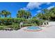 Outdoor hot tub surrounded by lush landscaping and lounge chairs at 6267 Midnight Pass Rd # 306, Sarasota, FL 34242