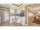 Charming kitchen with stainless steel appliances, mosaic backsplash, and dining table at 6267 Midnight Pass Rd # 306, Sarasota, FL 34242