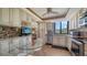 Bright kitchen featuring stainless steel appliances, mosaic backsplash, and breakfast nook at 6267 Midnight Pass Rd # 306, Sarasota, FL 34242