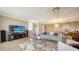 Cozy living room showcasing comfortable seating, modern entertainment, and decorative lighting at 6267 Midnight Pass Rd # 306, Sarasota, FL 34242