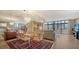 Bright living and dining area with hard floors and views of the balcony at 6267 Midnight Pass Rd # 306, Sarasota, FL 34242