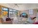Well-lit living room with plush seating, large windows, and stylish furniture at 6267 Midnight Pass Rd # 306, Sarasota, FL 34242