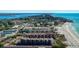 Wonderful aerial view of beachside condo complex with beach access to beautiful blue ocean waters at 6480 Midnight Pass Rd # 315, Sarasota, FL 34242
