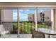 Balcony view of lush grounds, beach access and the building's pleasing exterior at 6480 Midnight Pass Rd # 315, Sarasota, FL 34242