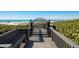 Charming beach access featuring a boardwalk path, beach views and black metal gate detail at 6480 Midnight Pass Rd # 315, Sarasota, FL 34242