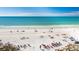 Aerial view of a pristine white sand beach and blue water on a sunny day at 6480 Midnight Pass Rd # 315, Sarasota, FL 34242