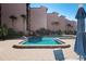Inviting community pool with comfortable lounge area and well-maintained grounds for residents to enjoy at 6480 Midnight Pass Rd # 315, Sarasota, FL 34242