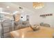 Comfortable dining area features counter seating and hanging light fixture at 6480 Midnight Pass Rd # 315, Sarasota, FL 34242