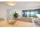 Bright living room with ocean view, modern furniture, and cozy decor, creating an inviting and relaxing space at 6480 Midnight Pass Rd # 315, Sarasota, FL 34242