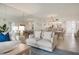 Spacious condo living and dining area with tile floors, neutral color scheme and beach view at 6480 Midnight Pass Rd # 315, Sarasota, FL 34242
