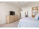 Well-appointed main bedroom with closet access and dresser offering ample storage and functionality at 6480 Midnight Pass Rd # 315, Sarasota, FL 34242