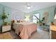 Serene bedroom featuring a pastel color palette, natural light, and comfortable furnishings at 6604 23Rd W Ave, Bradenton, FL 34209