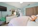 Inviting bedroom featuring a comfortable bed, ample storage, and serene decor at 6604 23Rd W Ave, Bradenton, FL 34209