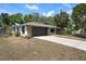 Beautiful home exterior with a well-maintained lawn, two-car garage, and stone accents at 6604 23Rd W Ave, Bradenton, FL 34209