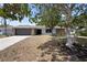 Charming home exterior with a two-car garage, and mature trees at 6604 23Rd W Ave, Bradenton, FL 34209