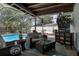 Screened lanai featuring an outdoor seating area with view to the pool and landscaped backyard at 6604 23Rd W Ave, Bradenton, FL 34209