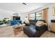 Comfortable living room with a large window, modern decor, and stylish furniture at 6604 23Rd W Ave, Bradenton, FL 34209