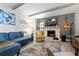 Inviting living room showcasing a stone fireplace, exposed beams, and comfortable seating arrangements at 6604 23Rd W Ave, Bradenton, FL 34209