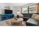 The cozy living room features a large window, modern decor, and stylish furniture at 6604 23Rd W Ave, Bradenton, FL 34209