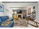 Bright living room with stone fireplace, exposed beams, and comfortable seating is perfect for relaxation at 6604 23Rd W Ave, Bradenton, FL 34209
