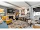 Inviting living room features a stone fireplace, exposed beams, and comfortable seating arrangements at 6604 23Rd W Ave, Bradenton, FL 34209