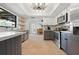 Open concept living space featuring a kitchen, dining room, and stainless steel appliances at 6604 23Rd W Ave, Bradenton, FL 34209