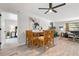 Open concept living space with dining table, living room, and view into main bedroom at 6604 23Rd W Ave, Bradenton, FL 34209