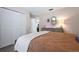 Comfortable main bedroom featuring a queen bed, an entrance door, and large closet at 6604 23Rd W Ave, Bradenton, FL 34209