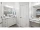 Elegant bathroom with dual vanities, ample storage, and modern finishes for a serene and functional space at 7016 Lennox Pl, University Park, FL 34201