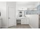 Bright bathroom with a makeup vanity, modern mirrors and hardware and walk in shower provides comfort and elegance at 7016 Lennox Pl, University Park, FL 34201