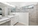 Modern bathroom with sleek vanity, frameless glass shower, and stylish tile work at 7016 Lennox Pl, University Park, FL 34201