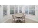 Bright breakfast nook features a round table and large windows at 7016 Lennox Pl, University Park, FL 34201