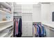 Well-organized walk-in closet with custom shelving, drawers, and hanging rods offers ample storage space at 7016 Lennox Pl, University Park, FL 34201