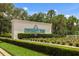 Attractive entrance sign for University Park, complemented by well-maintained landscaping and greenery at 7016 Lennox Pl, University Park, FL 34201