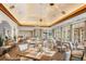 Elegant dining room with stylish lighting, large windows, and neatly set tables at 7016 Lennox Pl, University Park, FL 34201