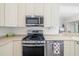 This kitchen has stainless steel appliances, range and abundant counter space at 7016 Lennox Pl, University Park, FL 34201