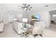 Open living room with a large television, recessed lights, and stylish decor makes this space open and inviting at 7016 Lennox Pl, University Park, FL 34201