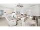 Inviting living room with a large sectional sofa, comfortable seating and an open floor plan provides comfort and style at 7016 Lennox Pl, University Park, FL 34201