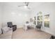 Bright office with multiple windows, plantation shutters, neutral decor, tile floors, ceiling fan and desk at 7016 Lennox Pl, University Park, FL 34201