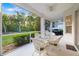 Relax on this beautiful screened patio with a lovely view of the landscaped yard at 7016 Lennox Pl, University Park, FL 34201
